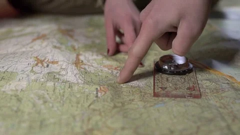 Couple planning hike route on a map, stock video Stock Footage 84272095