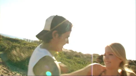 Couple playing on beach Stock Footage 43688507