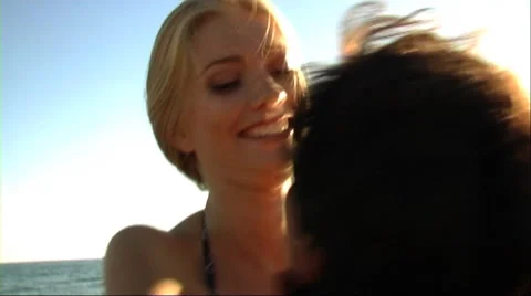 Couple playing on beach Stock Footage 43688759
