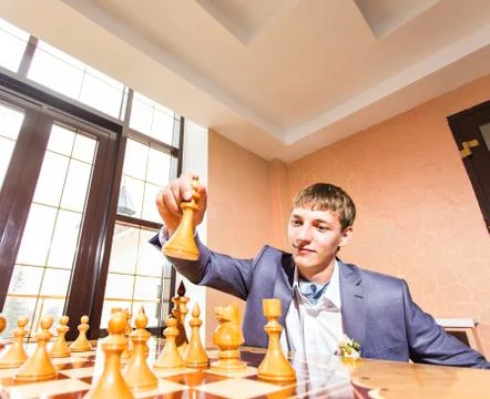 Couple playing chess on wedding day Stock Photos