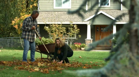 Couple playing in fallen leaves Video stock 61670905