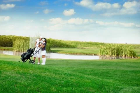 Couple playing golf Fotos Stock