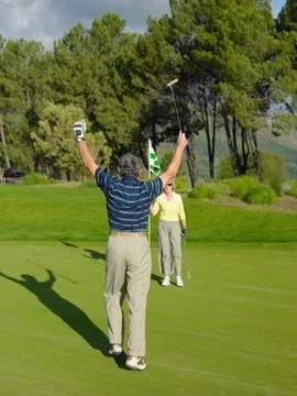 Couple playing golf Fotos de archivo