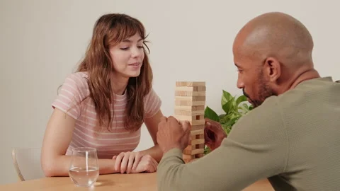 Couple Playing Jenga at Home Stock Footage 306485743