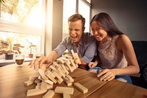 A couple is playing Jenga Stock Photos