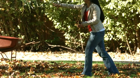 Couple playing with leaves Stock-Footage 61670748