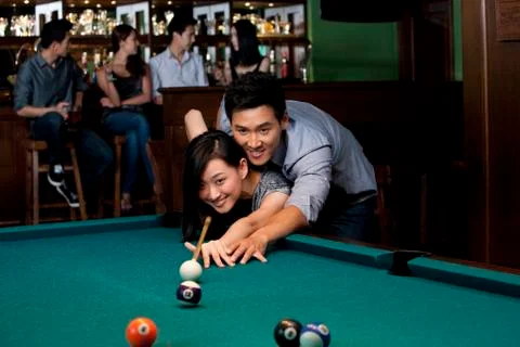 Couple Playing Pool Together Stock Photos