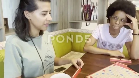 Couple playing scrabble 動画素材 249767465