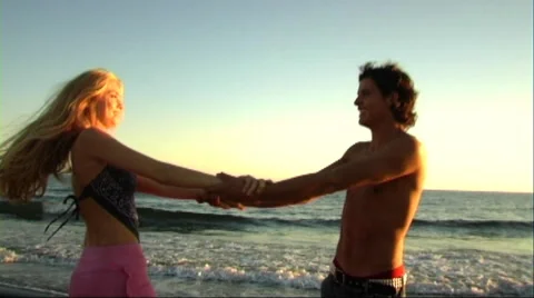 Couple playing in sea Stock Footage 43689142