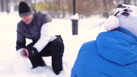 Couple playing in the snow Stock Footage 83106398