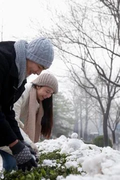 Couple Playing in the Snow Stock Photos