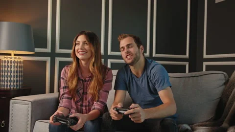 Couple playing video games on console together Stock Footage 130297154