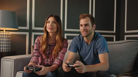 Couple playing video games on console together Stock Footage 130297211