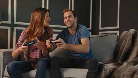 Couple playing video games on console together Stock Footage 130297254