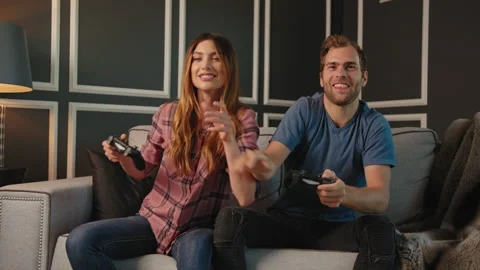 Couple playing video games on console together Stock Footage 130297258