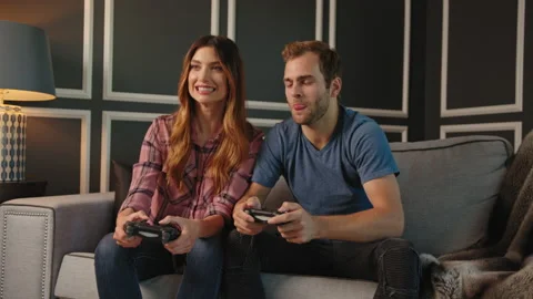 Couple playing video games on console together Stock Footage 130297286