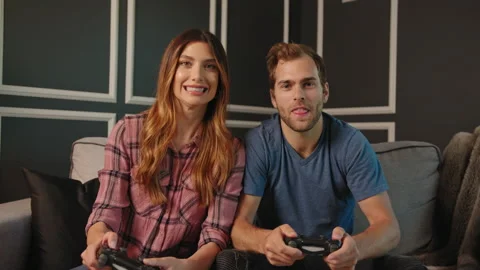 Couple playing video games on console together Stock Footage 130297321