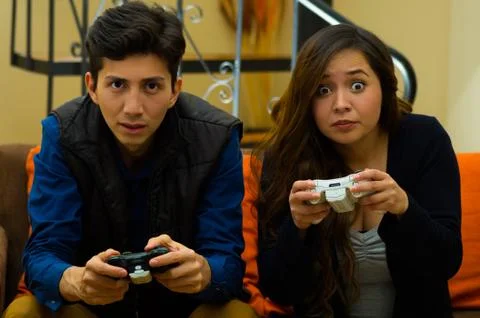 Couple playing video games on the couch. concept about home entertainment, video 스톡 사진