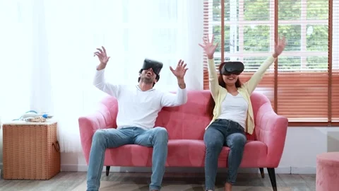 Couple playing virtual reality glasses Stock Footage 245821205