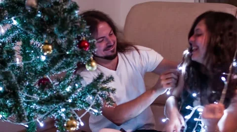 A couple plays with LED lights for Christmas Stock Footage 58113997