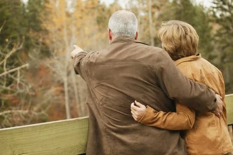 Couple Pointing To Trees Stock Photos