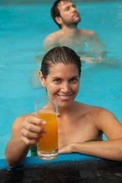 Couple in the pool having fun Stock Photos