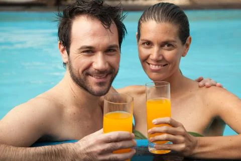 Couple in the pool having fun Stock Photos
