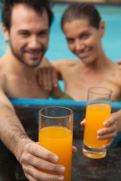 Couple in the pool having fun 스톡 사진