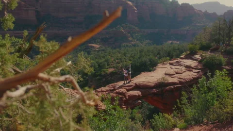 Couple poses on Devils Bridge, Sedona Stock Footage 227925923