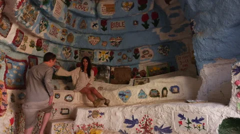 Couple Poses inside Salvation Mountain Stock Footage 47654054