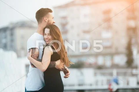 Couple posing against the backdrop of the city Stock Photos