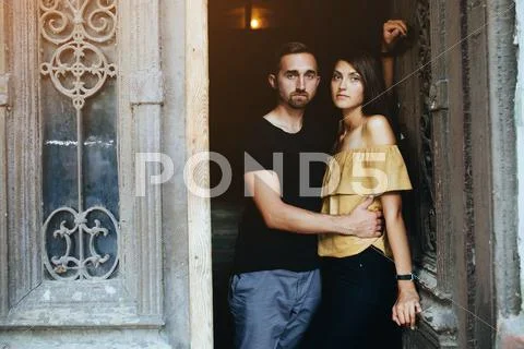 Couple posing in the doorway Stock Photos