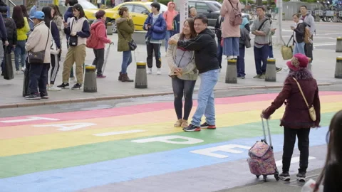 Couple posing at Rainbow crossing in Ximen, Taipei Stock Footage 255567692