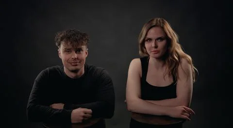 Couple posing together for modern studio portrait Stock Photos