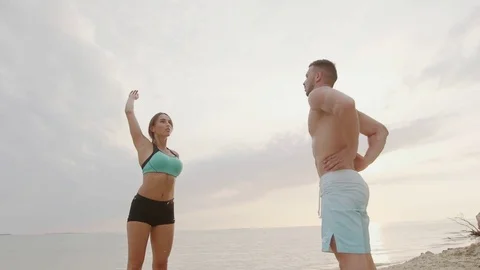 Couple practicing acroyoga at sunrise Stock Footage 77154672