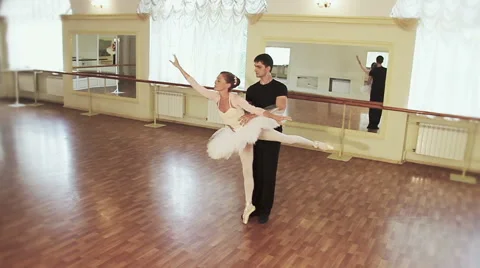 Couple practicing ballet dancing in front of mirrors, slow-mo Stock Footage 40284779