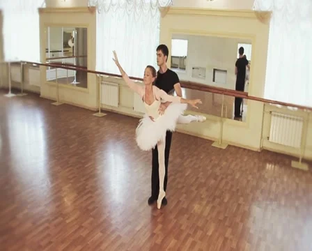 Couple practicing ballet dancing in front of mirrors, slow-mo Stock Footage 40286801
