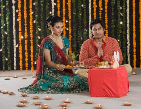 Couple praying on Diwali Stock Photos