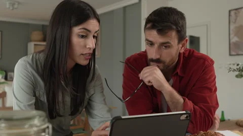 Couple prepare documents for work have coffee and breakfast at home Stock Footage 277301018