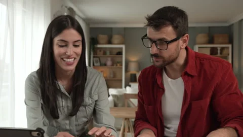 Couple prepare documents for work have coffee and breakfast at home Stock Footage 277301614