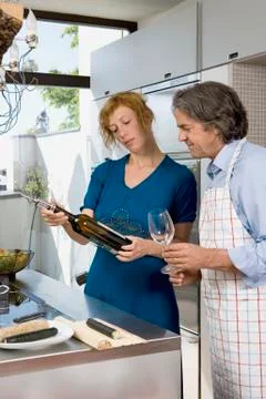 A couple preparing dinner Stock Photos