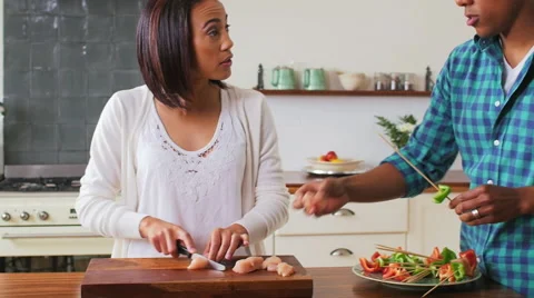 Couple preparing food together Stock Footage 58280985
