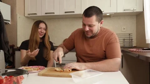 Couple Preparing Fresh Vegetables Together in a Modern Kitchen Stock Footage 307758643