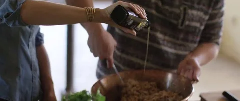 Couple preparing a meal in kitchen Stock Footage 69200523