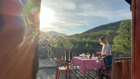 Couple Preparing Outdoor Picnic Dinner on Terrace with Mountain View at Sunset Stock-Footage 333526662