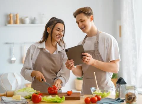 Couple is preparing the proper meal Stock Photos