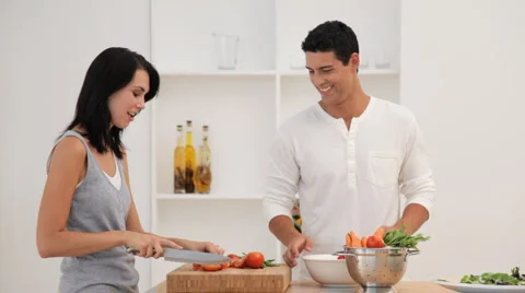 Couple Preparing a Salad in Kitchen Stock Footage 912365