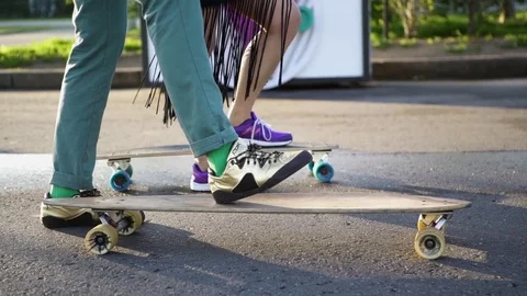 Couple preparing for skateboarding Stock-Footage 72512292