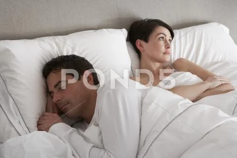 Couple With Problems Having Disagreement In Bed Stock Photos