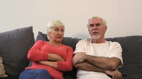 Couple problems. No emotional, upset elder couple sitting on the sofa. Stock Footage 102569205